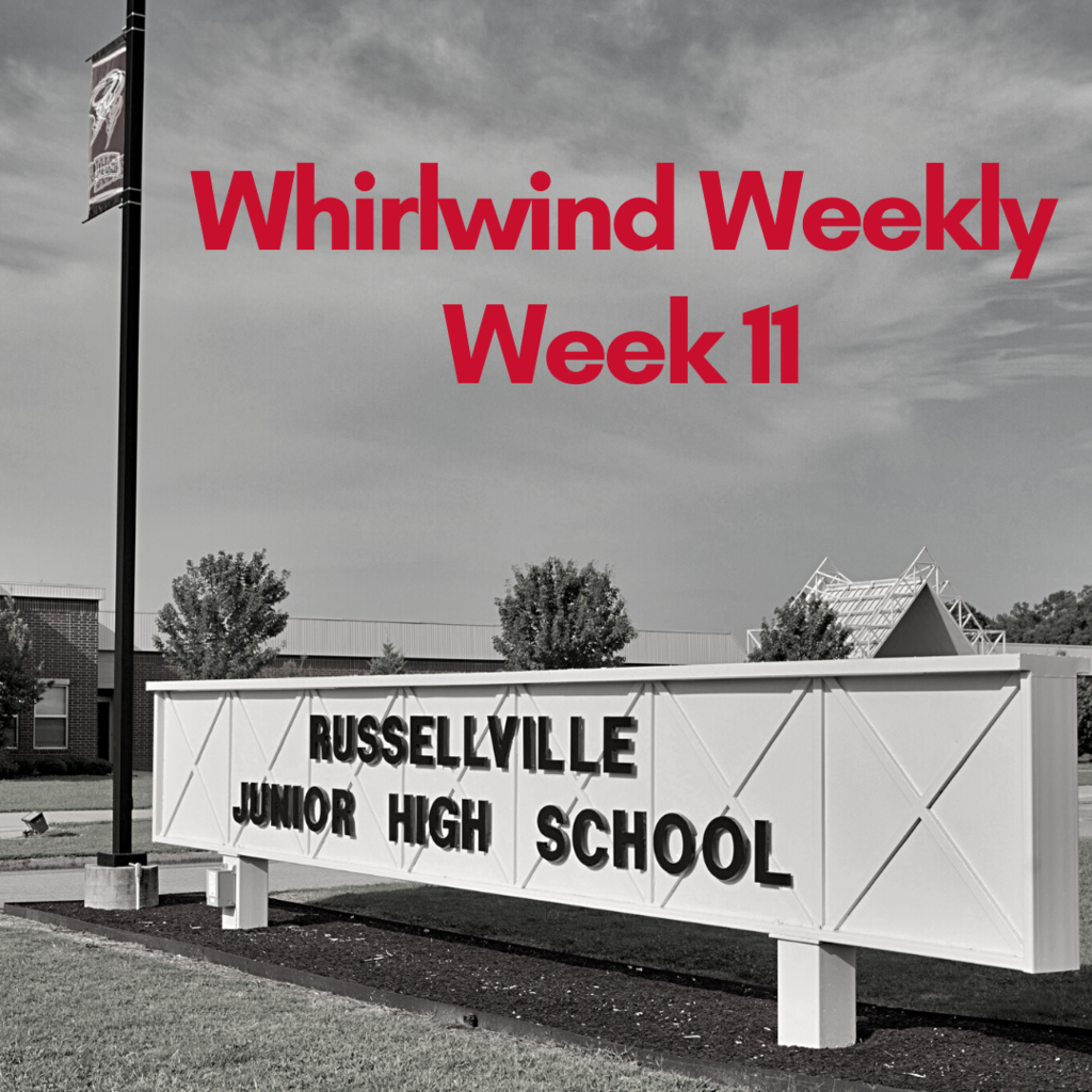 black and white photo of school sign with red text 