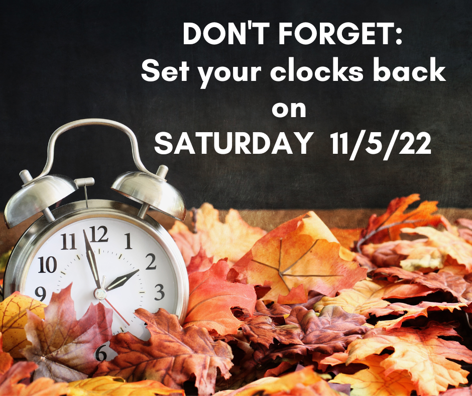 clock with leaves around it and white text