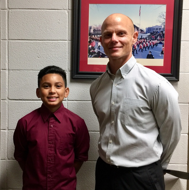 RMS student of the month poses with RMS principal Work.